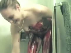 Kinky gal plays with chocolate and berry syrups in the shower 